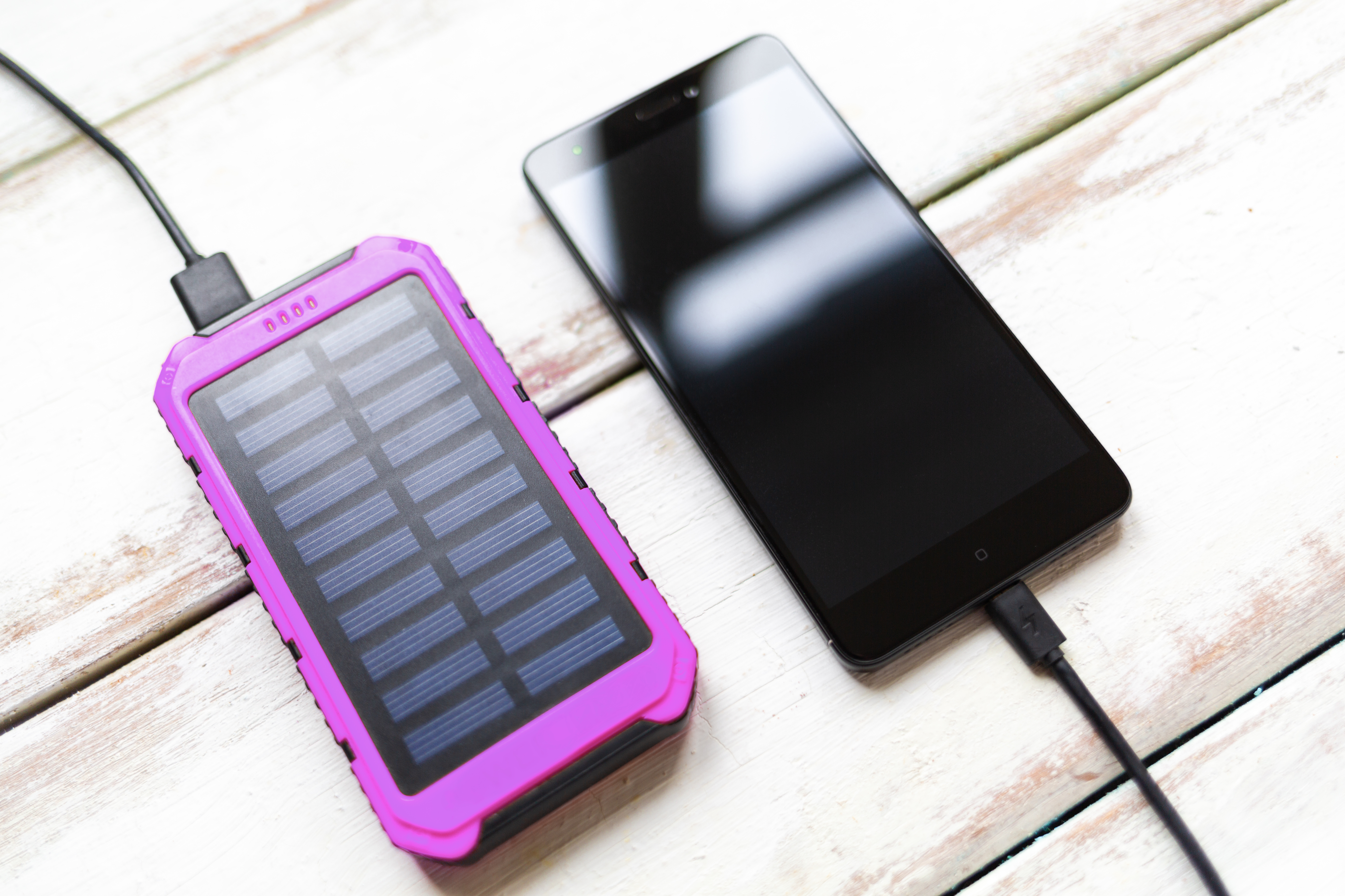 Solar battery pack connected to a smartphone